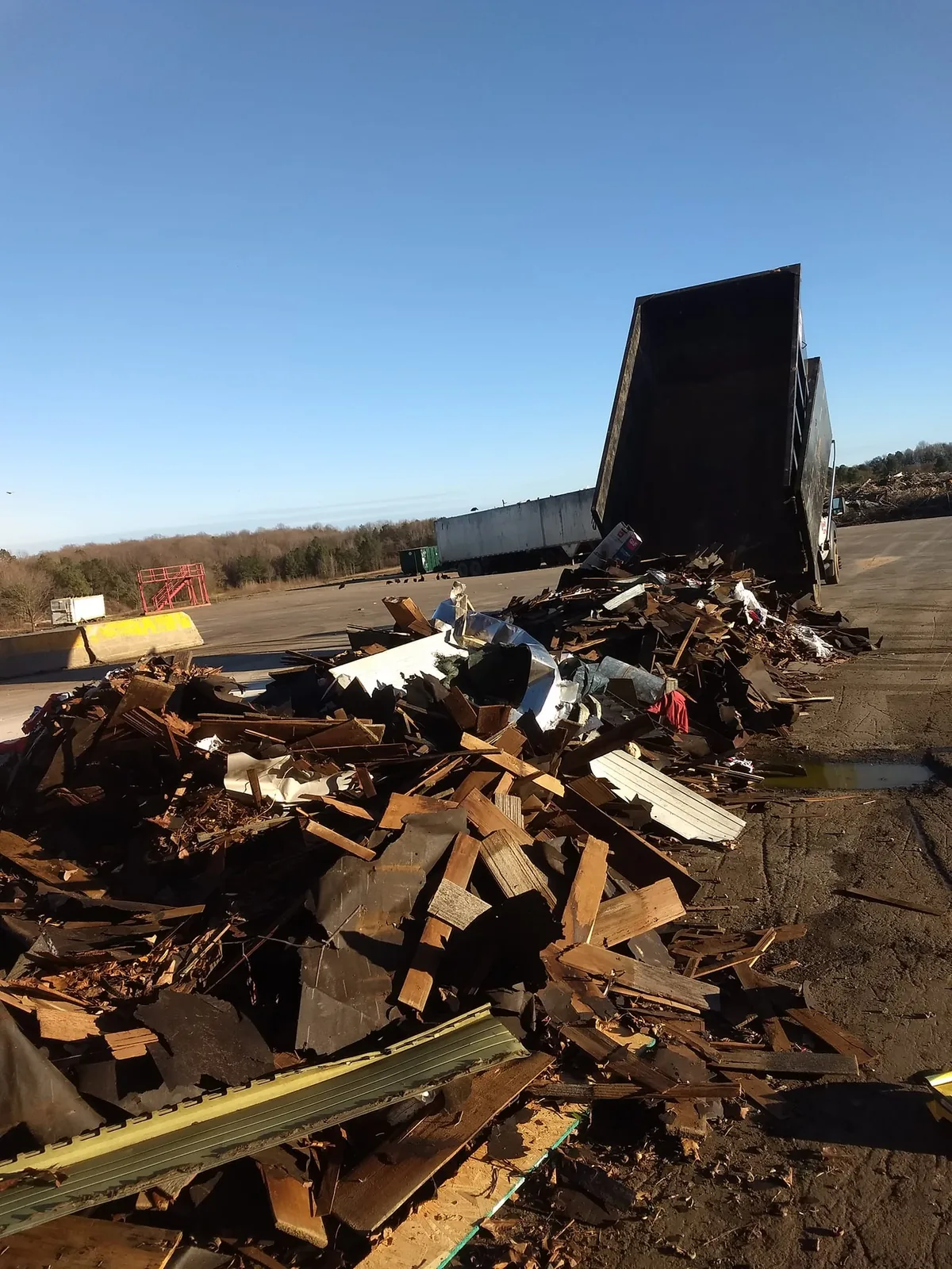 Dumpster load being dumped at transfer station