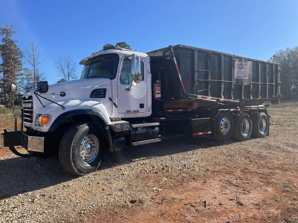 Roll-Off Express truck with black dumpster
