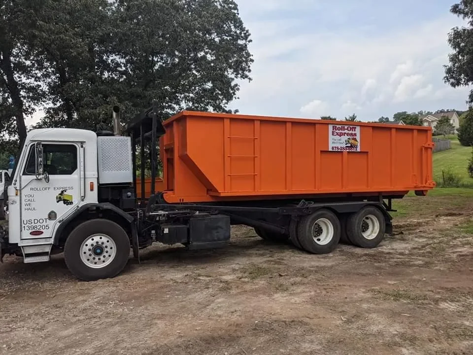 Roll-Off Express orange delivery truck